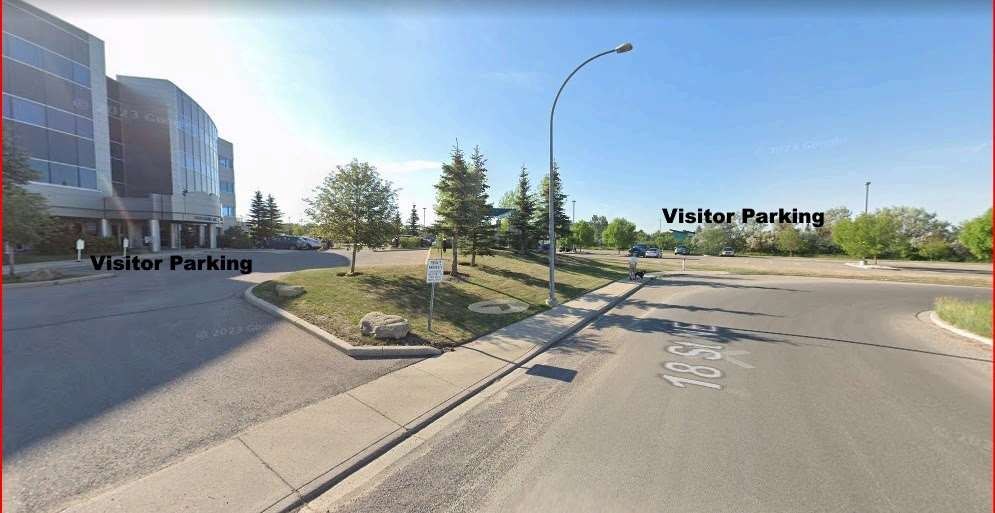 View along 18 Avenue NE showing Visitor Parking areas on both sides of the road