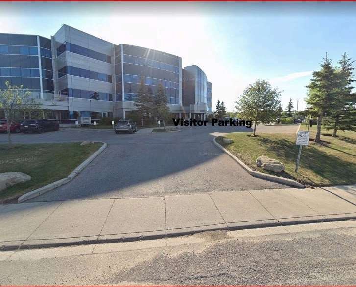 Entrance to the visitor parking area beside the building