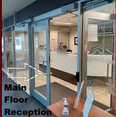 Glass doors leading to the main floor reception of the Smart Executive Centre